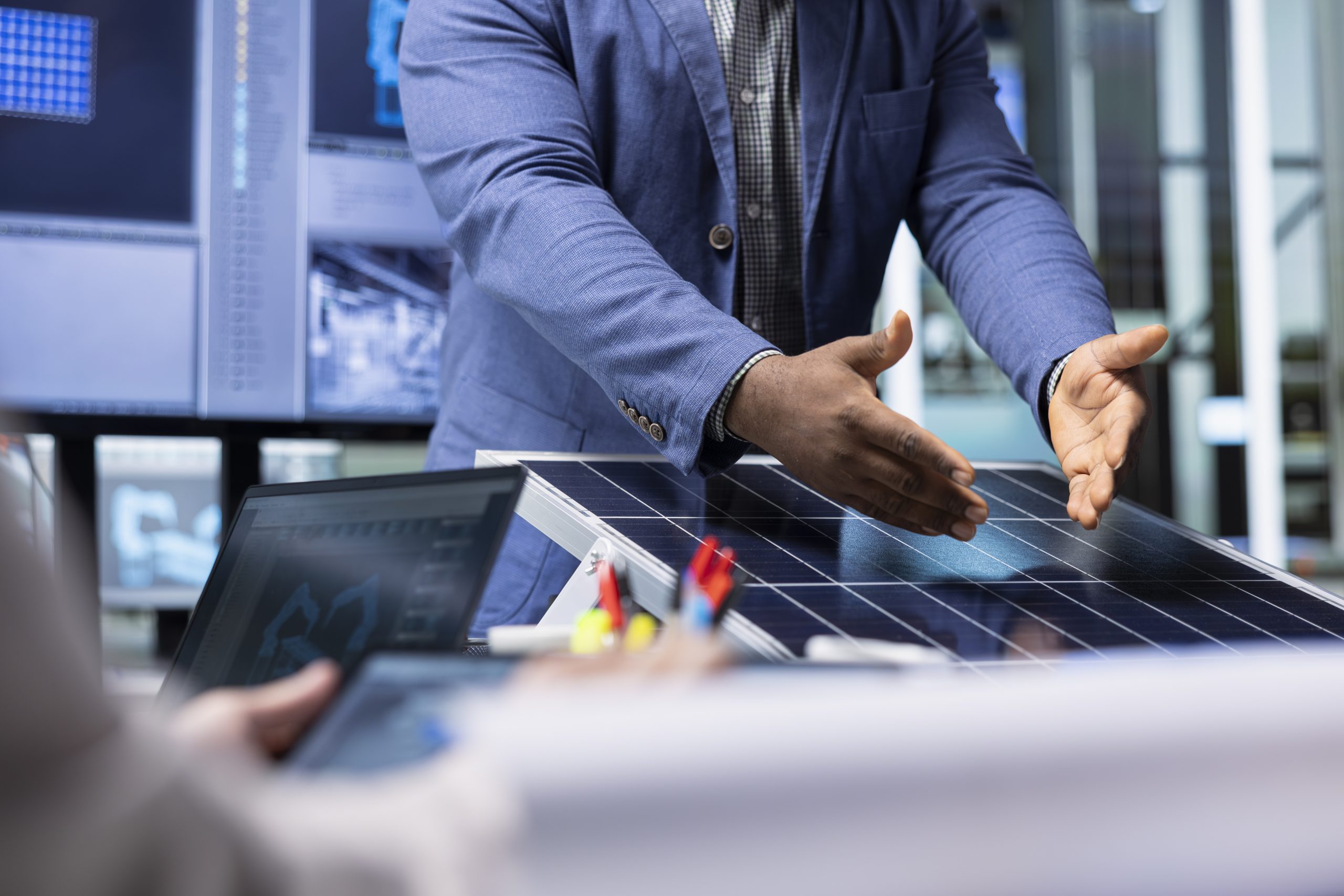 Factory investors meeting to chat about technical improvements to solar cells